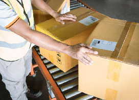 Warehouse worker sending out orders
